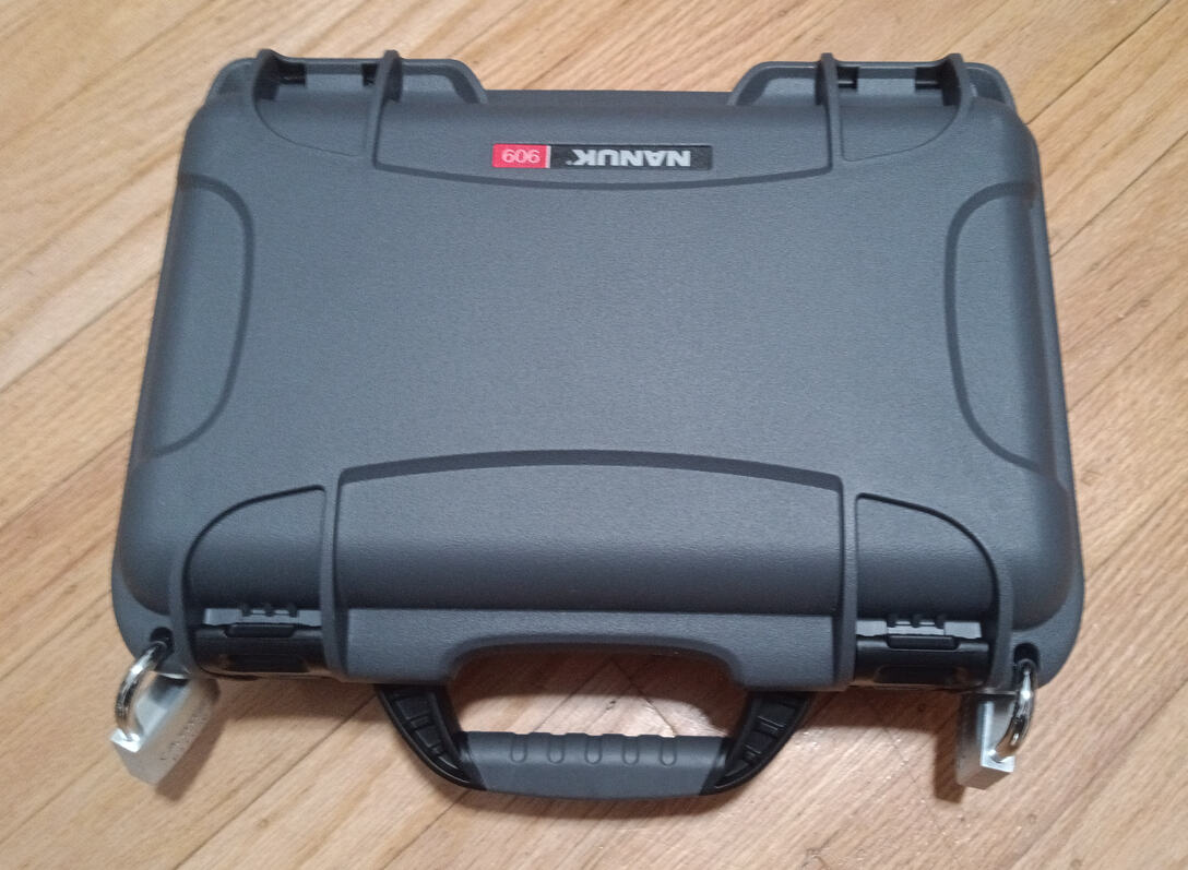 A Nanuk 909 hard case, with two Abloy